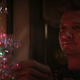 Clint decorating a christmas tree.